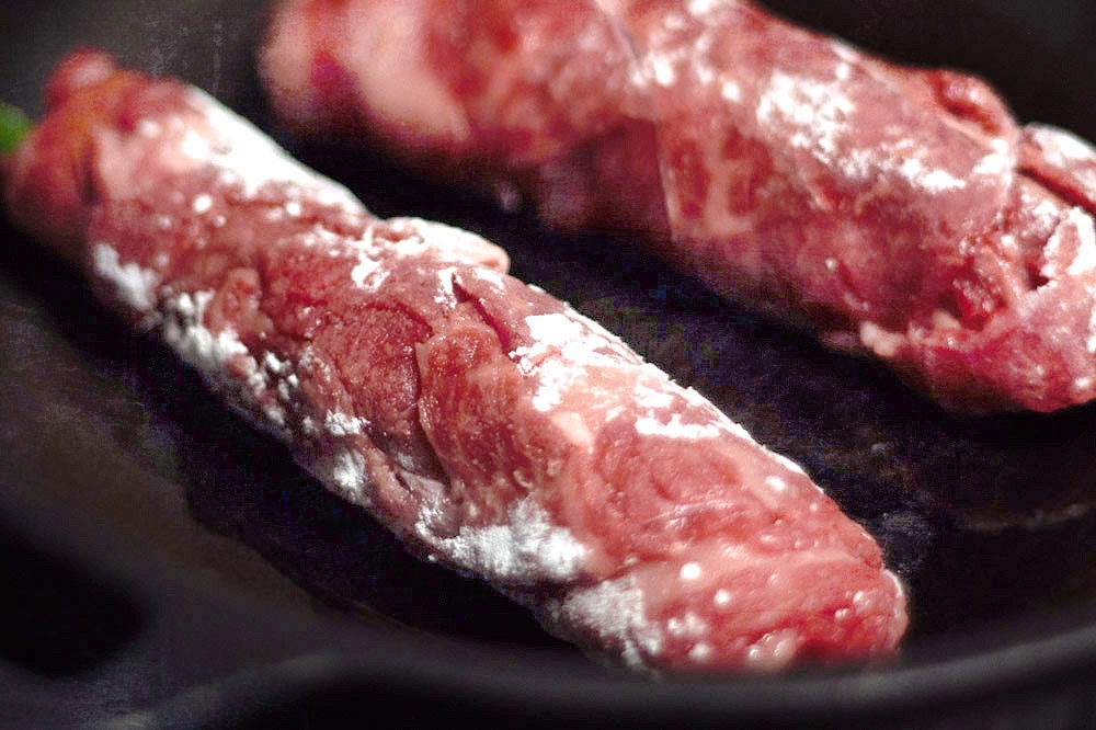 Sauté the beef rolls, ensuring not to overcrowd the pan.