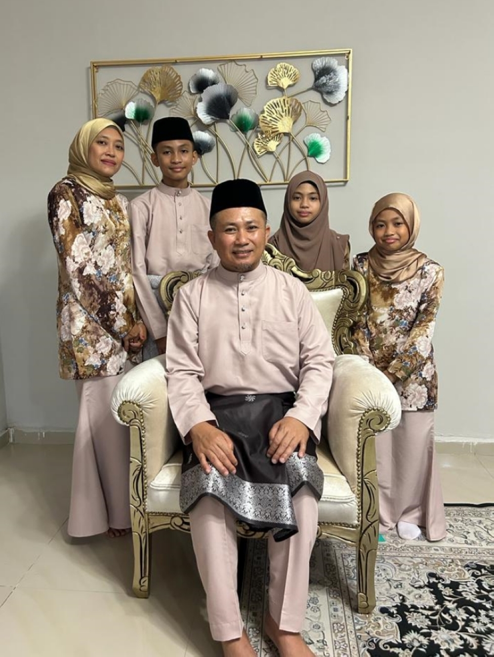 Syuhaira, seen with her family in this photo, is often mistaken for a Sarawakian owing to her fluency in both Bahasa Sarawak and Melanau. ― Borneo Post pic