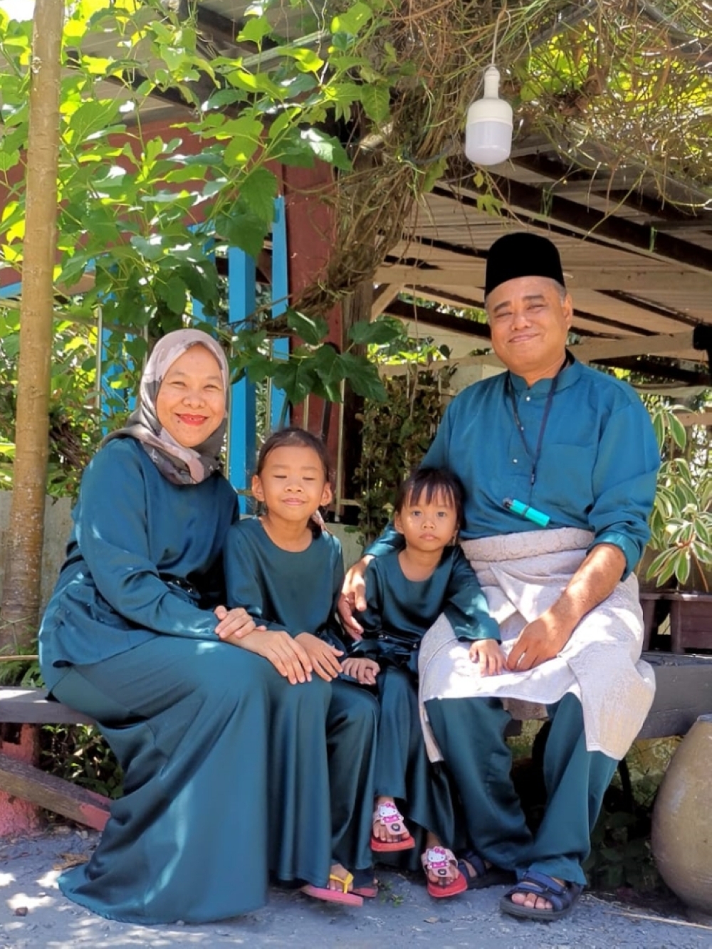 Raja Idham and his family are pictured during Hari Raya Aidilfitri at Kampung Pujut Tanjong Batu, Miri. ― Borneo Post pic