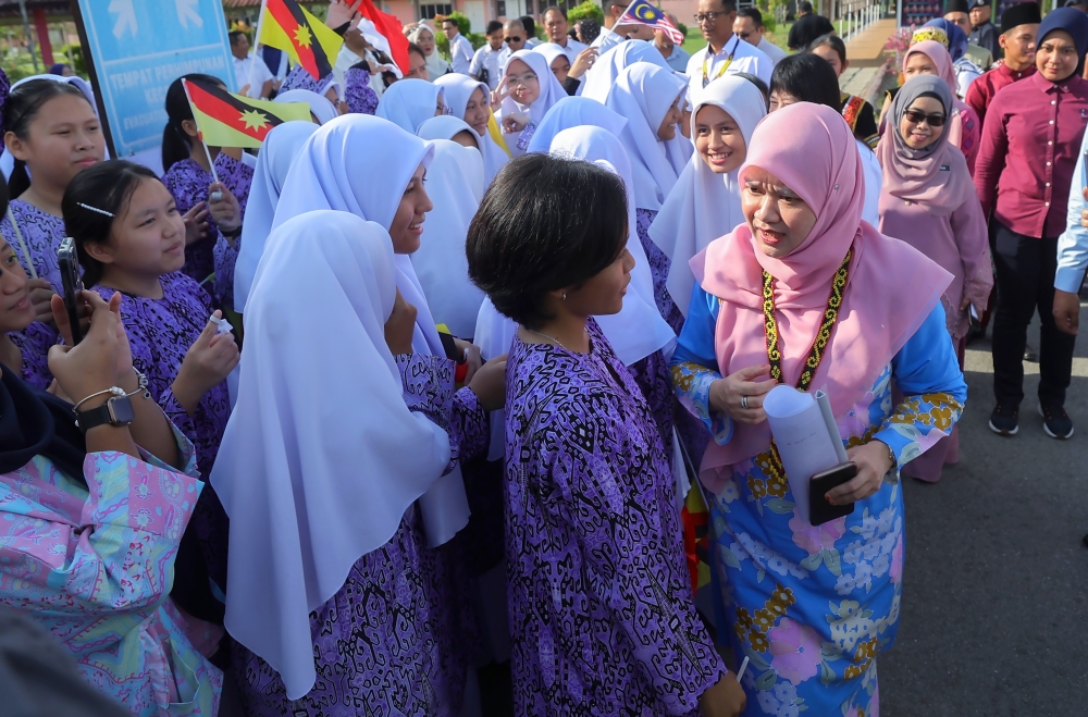 Education Minister Fadhlina Sidek (right) meets students at the Malaysia Day celebration at Sekolah Menengah Sains Kuching September 16, 2023. — Bernama pic