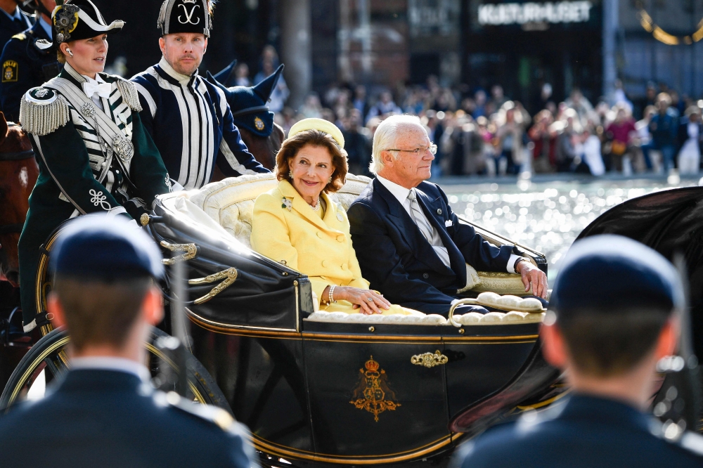 Tens of thousands of Swedes thronged central Stockholm yesterday to mark 50 years since King Carl XVI Gustaf ascended the throne. — AFP pic