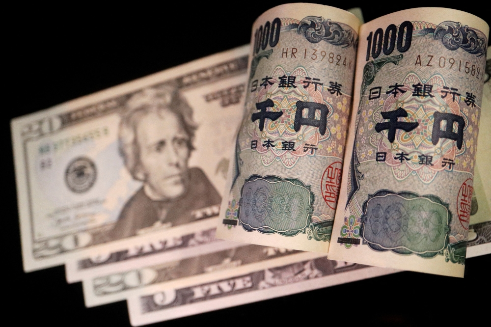 Banknotes of Japanese yen and U.S. dollar are seen in this illustration picture taken September 23, 2022. — Reuters pic