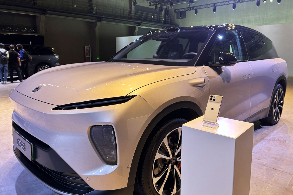 A Nio Phone is displayed next to a Nio ES8 SUV during the Chinese electric vehicle (EV) maker's tech day in Shanghai, China September 21, 2023. — Reuters pic