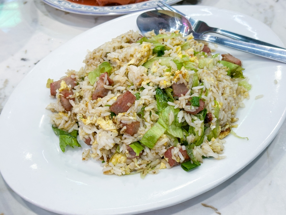 The simple Yangzhou style Fried Rice shows off the chef's skill as each rice grain is fried with egg.