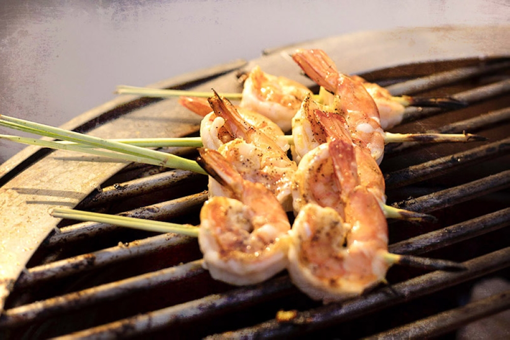 The skewers are done once the prawns are orangish-pink.