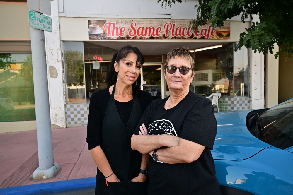 Mickey Stoner (right) and daughter in law Bianca Hiler (left) stand outside The Same Place Cafe, the only business that serves dinner along a once thriving Center Street in Taft, Kern County, California September 21, 2023. — AFP pic