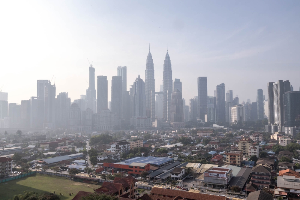 A general view of the Kuala Lumpur city skyline shrouded in haze. — Picture by Firdaus Latif
