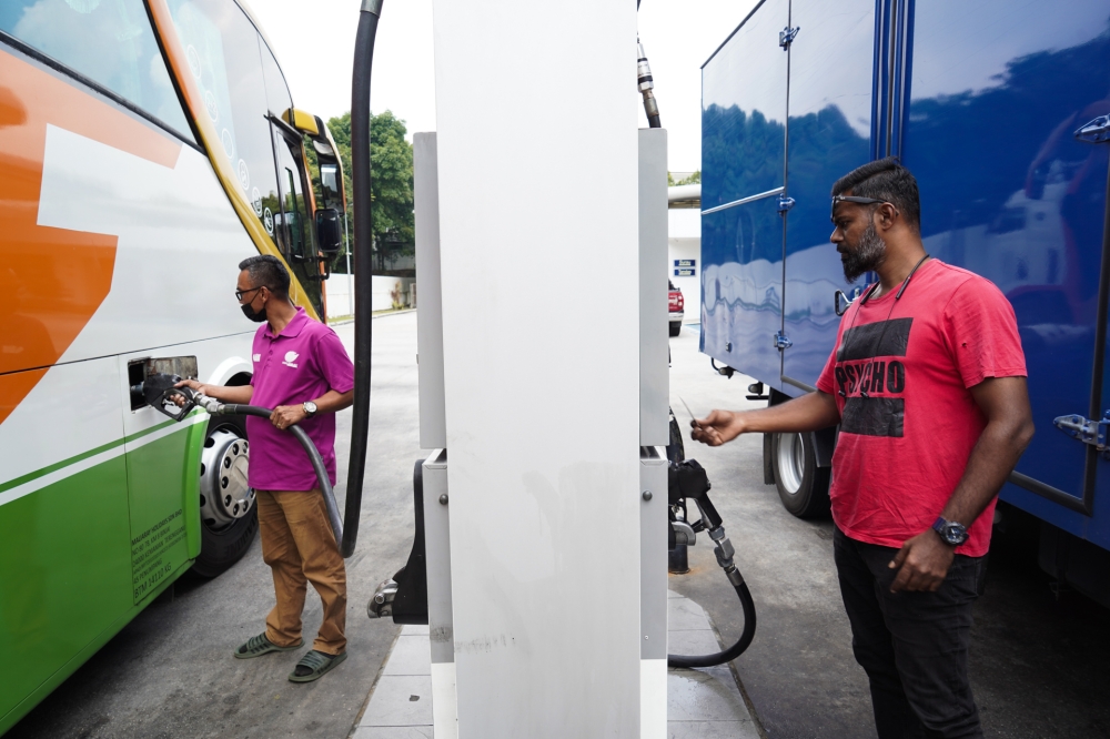 Buses refuelling diesel at a petrol station in Petaling Jaya, October 12, 2023. In February, Datuk Seri Anwar Ibrahim divulged that while Putrajaya had spent RM20 billion in diesel subsidy in 2022, only half of that volume was sold through petrol stations. — Picture by Ahmad Zamzahuri