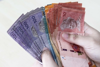 Ringgit Opens Lower Against US Dollar Amid Cautious Sentiment | Malay Mail