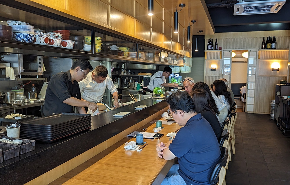 The bar counter is where the sushi set is served that requires a reservation, but the regular seating (not pictured) does not.