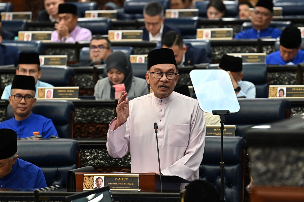 Prime Minister Datuk Seri Anwar Ibrahim tables Budget 2024 in the Dewan Rakyat October 13, 2023. ― at the Malaysian parliament, in Kuala Lumpur, Malaysia, October 13, 2023. Famer Roheni /Department of Information Malaysia/ Handout via Reuters