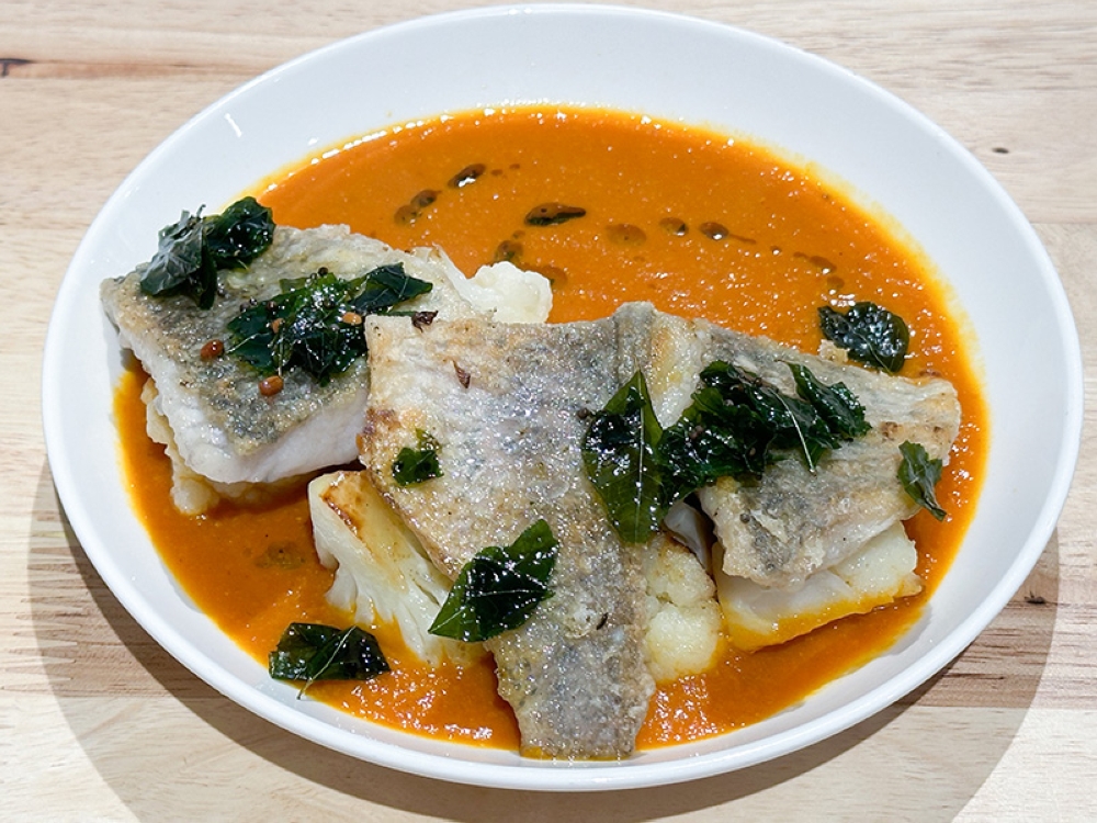 Tomato Masala Fish showcases the chef's skills as the pan fried sea bass has a crisp skin, moist flesh and that addictive creamy sauce with its tangy, fragrant flavours