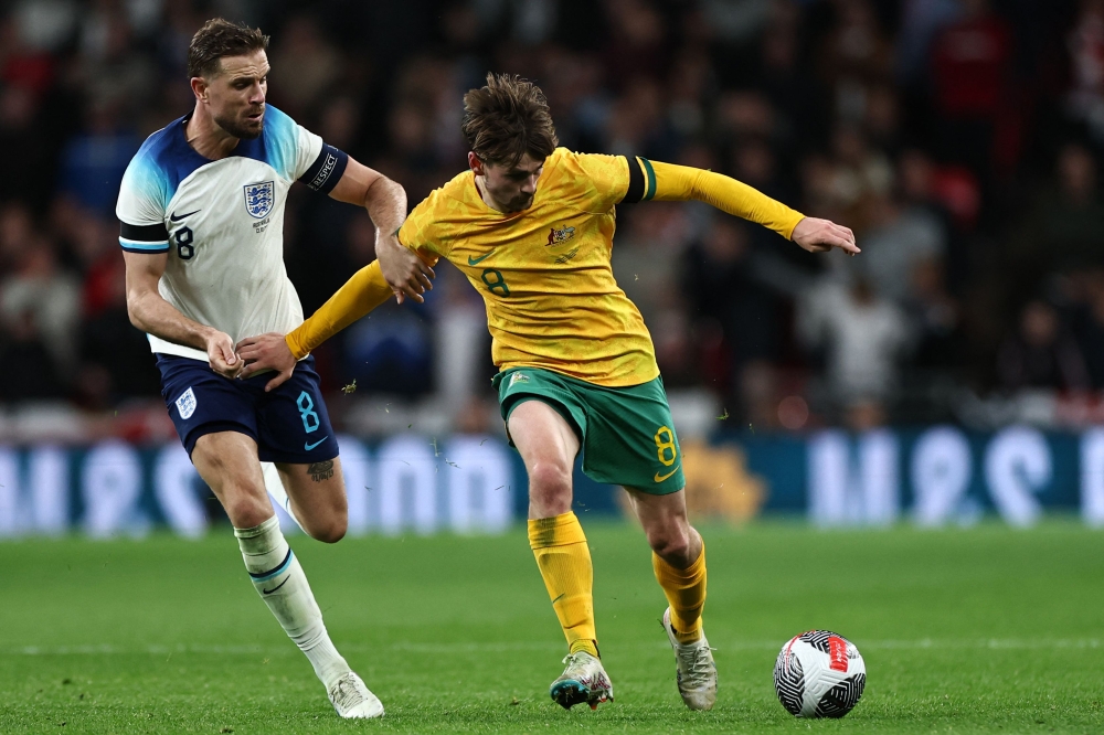 England's midfielder Jordan Henderson (left) vies with Australia's midfielder Connor Metcalfe (right) during the international friendly football match between England and Australia at Wembley stadium in north London October 13, 2023. — AFP pic