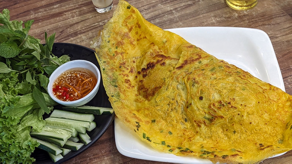 The large 'bánh xèo', a popular type of stuffed Vietnamese 'crêpe'.