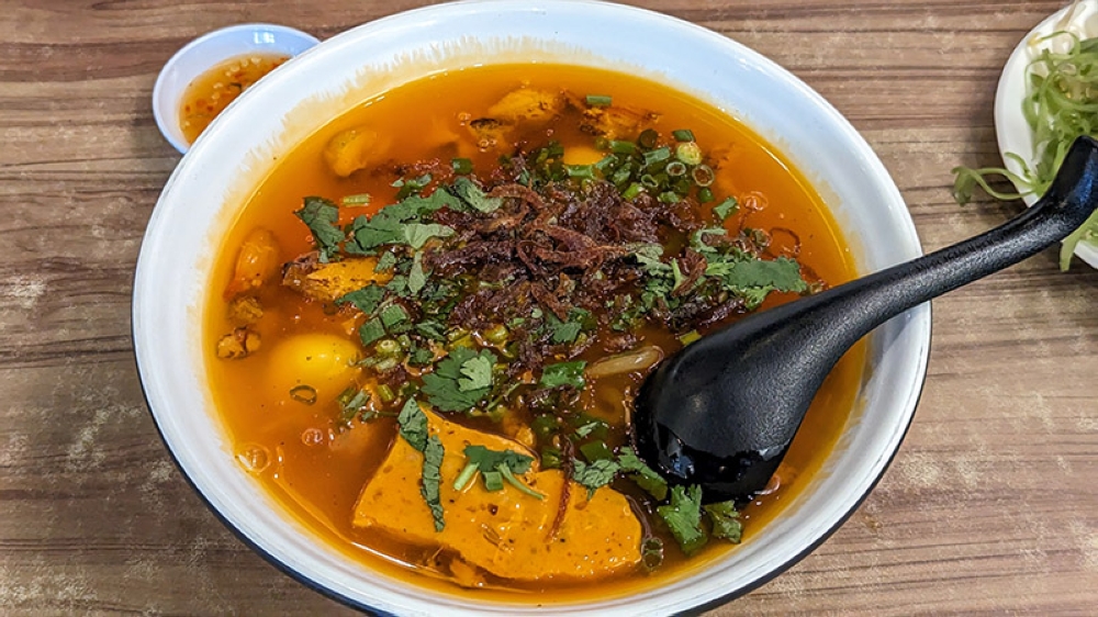 The thick, rich and seafood-forward broth in the 'bánh canh cua' is delightful.