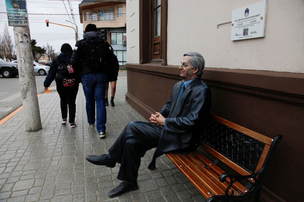 People walk past a statue of Argentina’s late President Nestor Kirchner, in Rio Gallegos, Argentina October 11, 2023. — Reuters pic