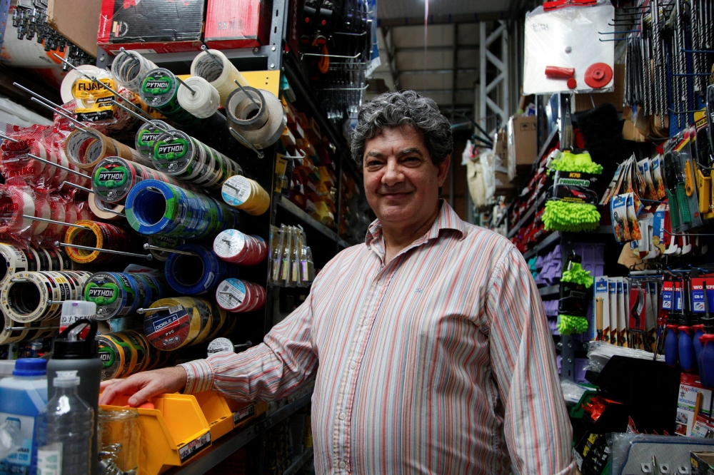 Guillermo Carnevale, 58, a supporter of Argentina’s presidential candidate Javier Milei, poses for a photograph at his small hardware store, in Rio Gallegos, Argentina October 10, 2023. — Reuters pic