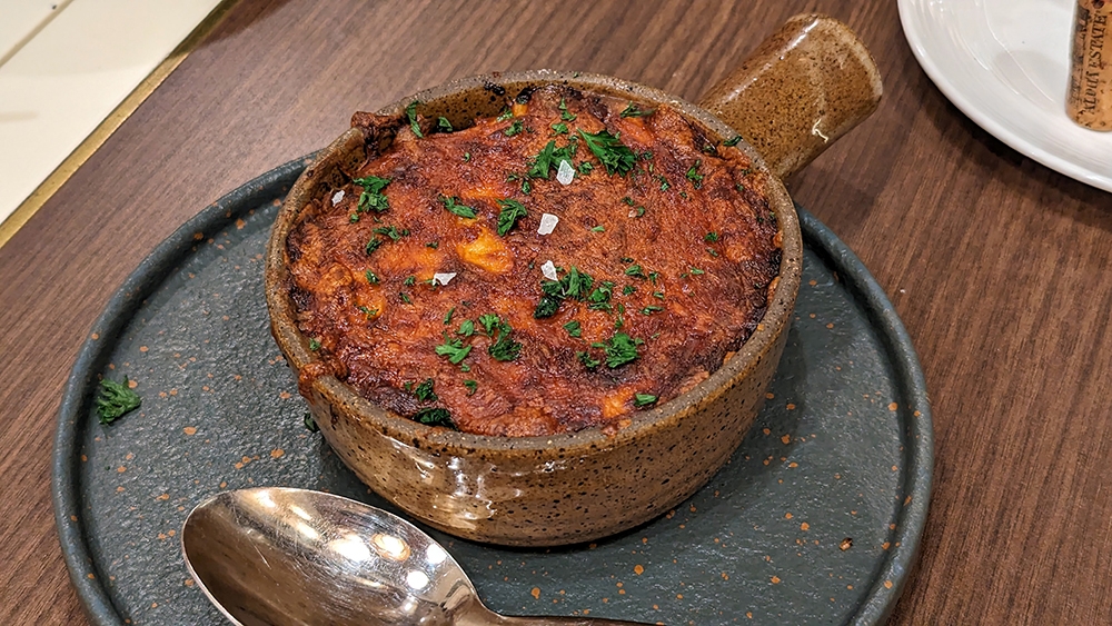 'Moussaka', a Greek staple, is served here.