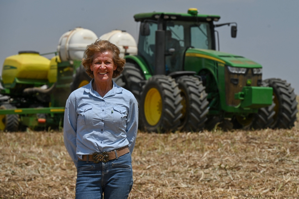 Farmer Carminha Maria Missio poses for a picture in an agricultural field on her family's farm in Barreiras, western of the Bahia state, Brazil, on October 2, 2023. — AFP pic