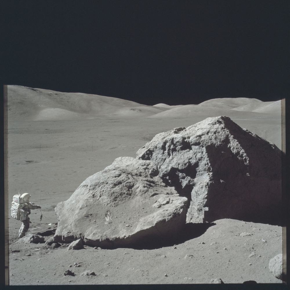 Scientist-astronaut Harrison Schmitt is photographed standing next to a huge, split boulder during the third Apollo 17 extravehicular activity (EVA) at the Taurus-Littrow landing site on the moon during the Apollo 17 mission in this December 13, 1972 Nasa handout photo. — Nasa handout pic via Reuters     