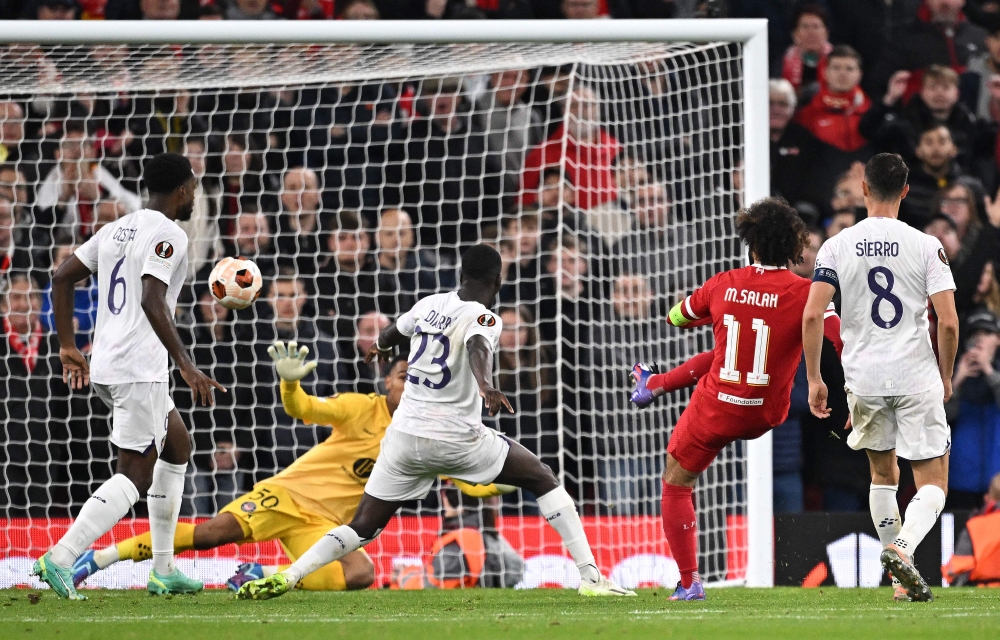 Liverpool's Egyptian striker #11 Mohamed Salah scores the team's fifth goal during the Uefa Europa League group E football match between Liverpool and Toulouse at Anfield in Liverpool, north west England on October 26, 2023. — AFP pic