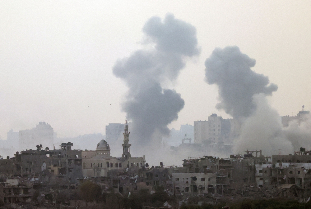 Smoke is rising after an Israeli strike on Gaza seen from a viewpoint in Southern Israel October 24, 2023. The three 12 metre-long trailers carrying all the humanitarian goods will leave from Cairo for the city of Al-Arish, which is located 45 kilometres from the Rafah crossing that separates Egypt and Gaza.  — Reuters pic