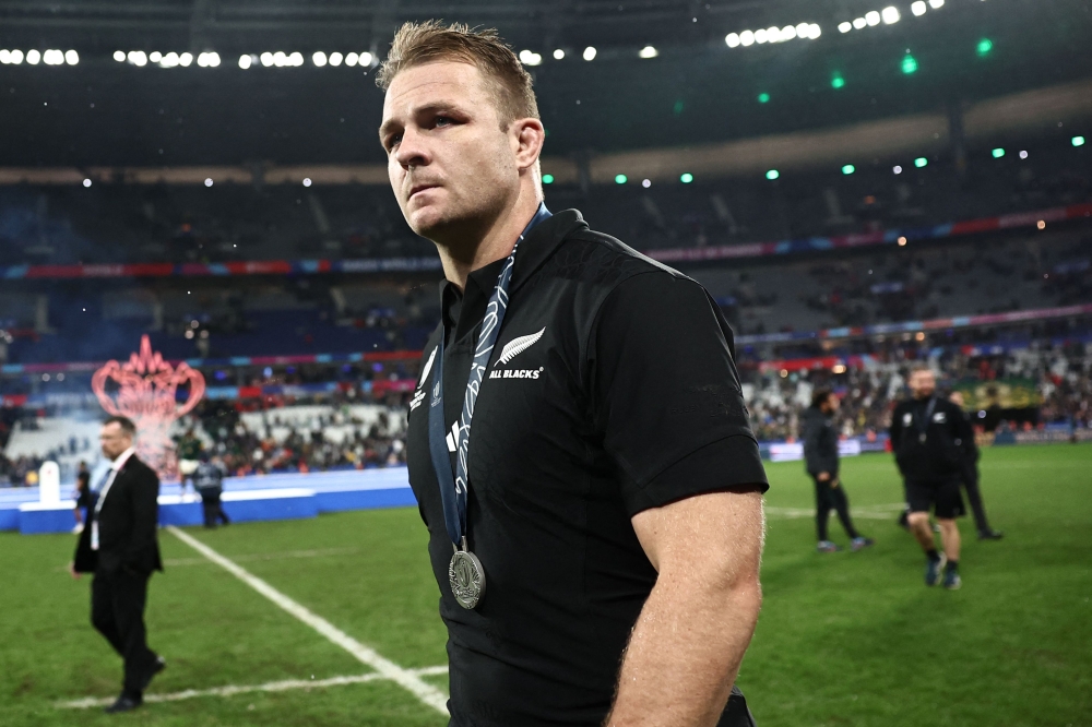 New Zealand's openside flanker and captain Sam Cane walks on the field with his silver medal after South Africa won the France 2023 Rugby World Cup Final. — AFP pic