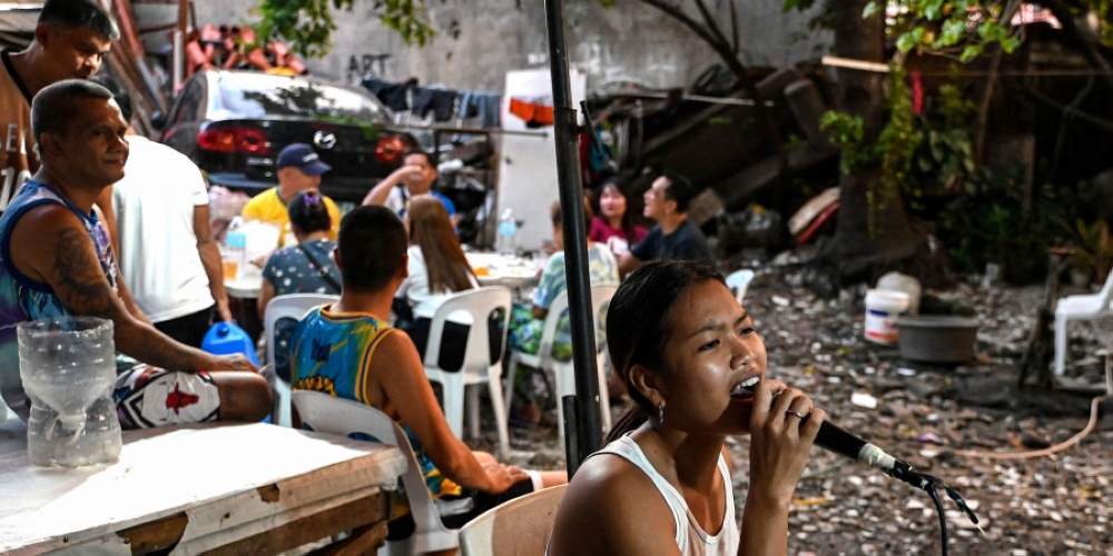 For many Filipinos, karaoke is one of the few affordable entertainment options available to them. — AFP pic