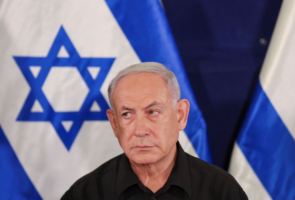 Israeli prime minister Benjamin Netanyahu, who has drawn public ire for not taking responsibility over the intelligence and operational failures surrounding Hamas’ rampage through southern Israel, later erased the remarks posted on social media platform X today. — Pool via Reuters pic