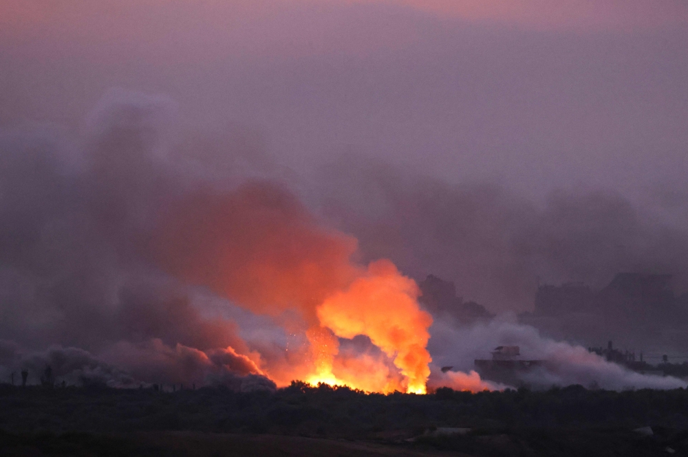 A picture taken from Israel’s southern city of Sderot shows a fire erupting following Israeli shelling of the northern Gaza Strip on October 29, 2023. — AFP pic