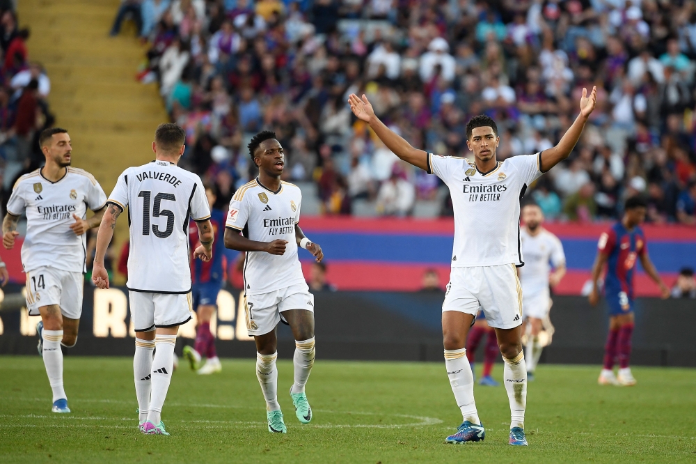 Real Madrid's English midfielder Jude Bellingham celebrates after scoring a goal during the Spanish league football match between FC Barcelona and Real Madrid CF at the Estadi Olimpic Lluis Companys in Barcelona October 28, 2023. — AFP pic