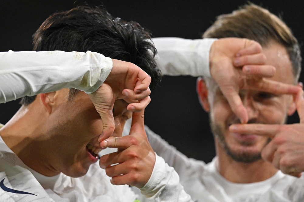 Tottenham Hotspur's South Korean striker Son Heung-Min (left) celebrates scoring the team's second goal with Tottenham Hotspur's English midfielder James Maddison during the English Premier League football match between Crystal Palace and Tottenham Hotspur at Selhurst Park in south London October 27, 2023. — AFP pic