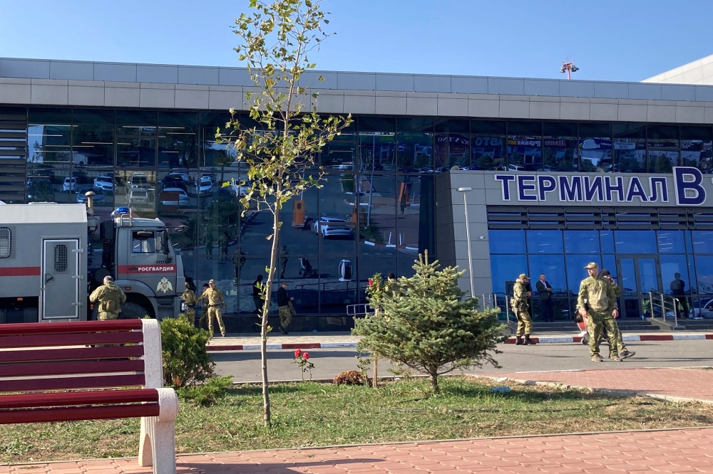 Law enforcement officers patrol an area outside the airport in Makhachkala on October 30, 2023. — AFP pic