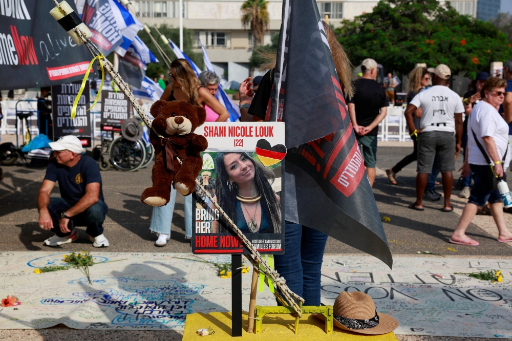 A picture of Shani Nicole Louk, who is missing, is displayed during a demonstration by family members and supporters of hostages who are being held in Gaza, as they call for a dialogue with Israeli Prime Minister Benjamin Netanyahu and Defence Minister Yoav Gallant, in Tel Aviv, Israel October 28, 2023. — Reuters pic 