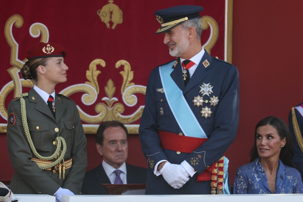 (From left) Spanish Crown Princess of Asturias Leonor, Spain's King Felipe VI and Spain's Queen Letizia attend the Spanish National Day military parade in Madrid October 12, 2023. — AFP pic