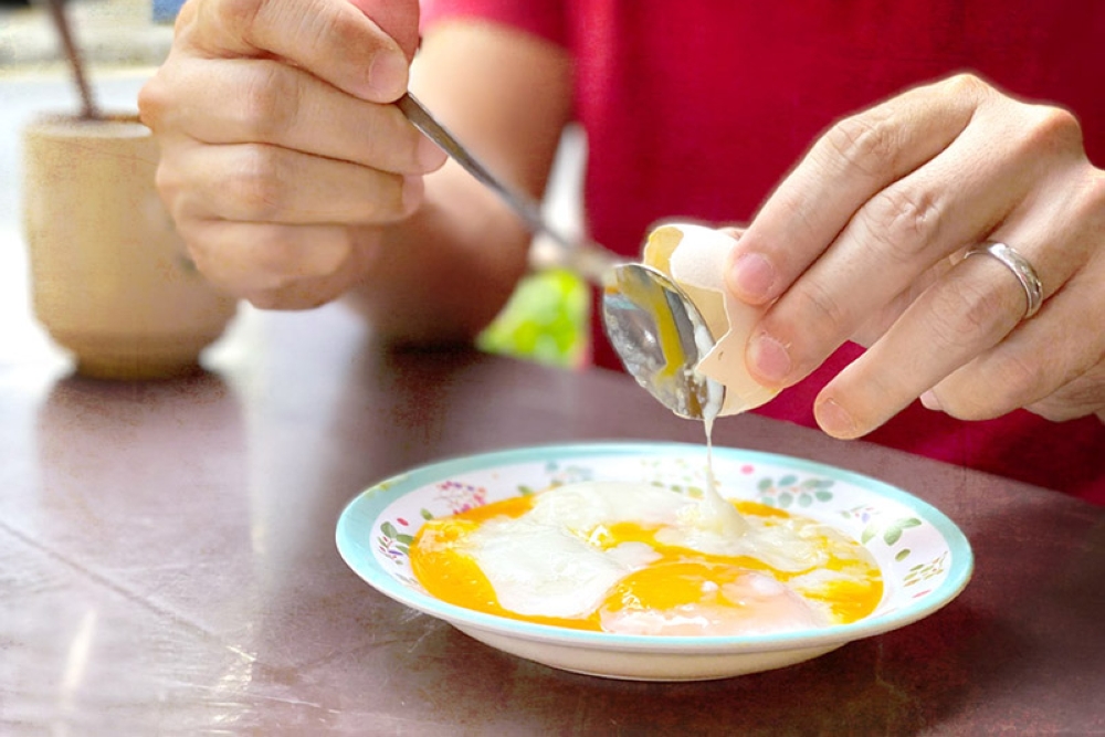 Crack the eggs and spoon out every bit of goodness.