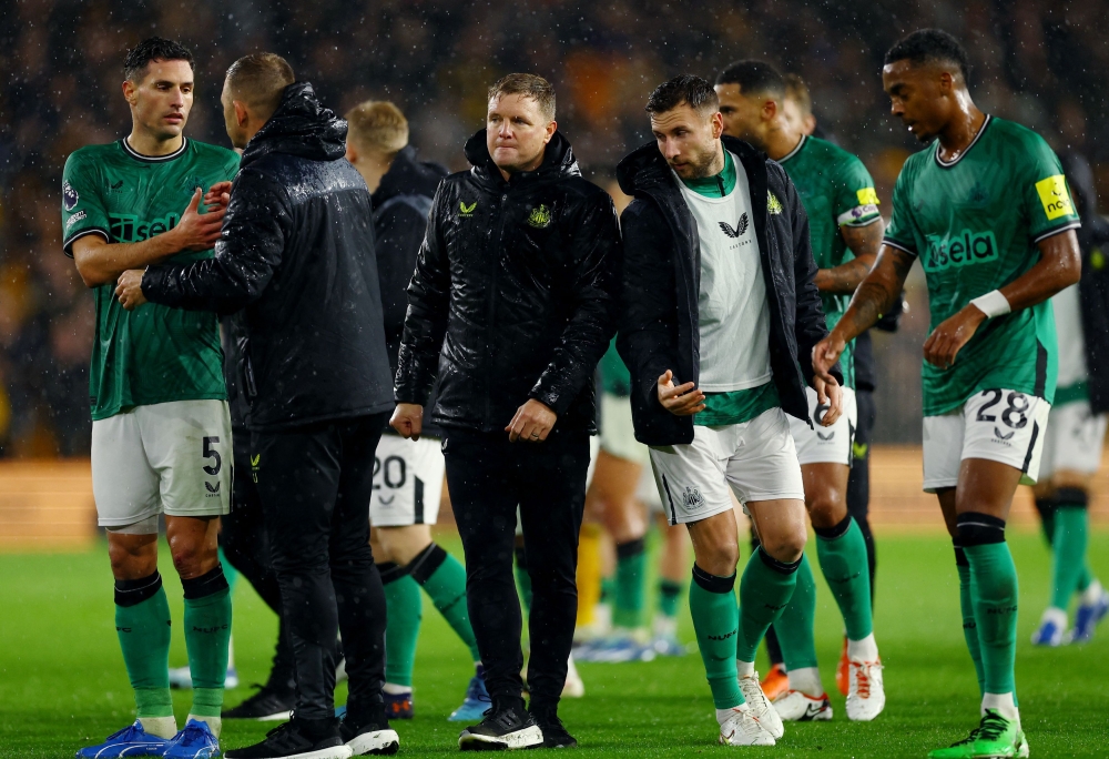 Newcastle United manager Eddie Howe, Fabian Schar, Joe Willock and Paul Dummett react after the match against Wolverhampton Wanderers at Molineux Stadium, Wolverhampton, October 28, 2023. — Reuters pic 