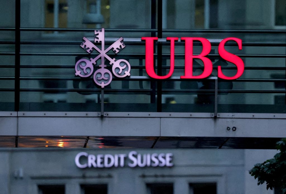 Logos of Swiss banks Credit Suisse and UBS are seen before a news conference in Zurich Switzerland, August 30, 2023. — Reuters pic