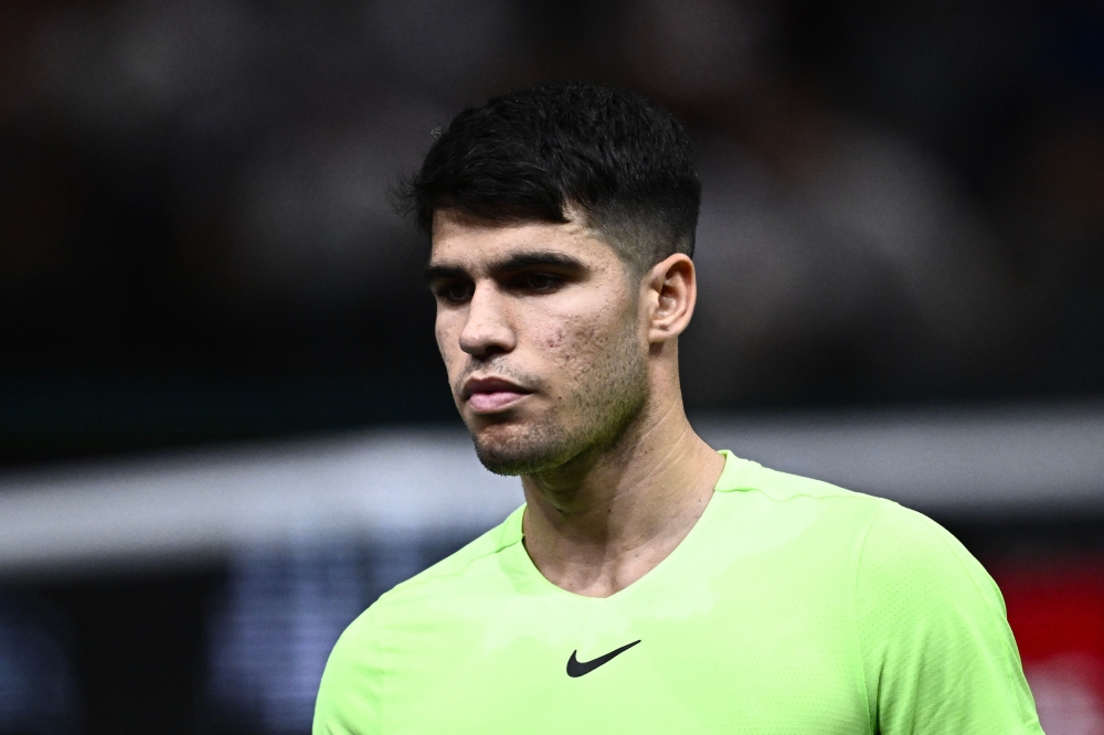 Spain's Carlos Alcaraz reacts after losing his men's singles match against Roman Safiullin on day two of the Paris ATP Masters 1000 tennis tournament at the Accor Arena - Palais Omnisports de Paris-Bercy - in Paris October 31, 2023. — AFP pic