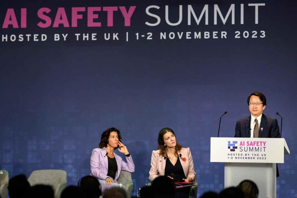 (From left) US Commerce Secretary Gina Raimondo and Britain's Science, Innovation and Technology Secretary Michelle Donelan listen as China's Vice-Minister, Ministry of Science and Technology Wu Zhaohui speaks during the UK Artificial Intelligence (AI) Safety Summit at Bletchley Park, in central England, on November 1, 2023. — Leon Neal/Pool/AFP pic  