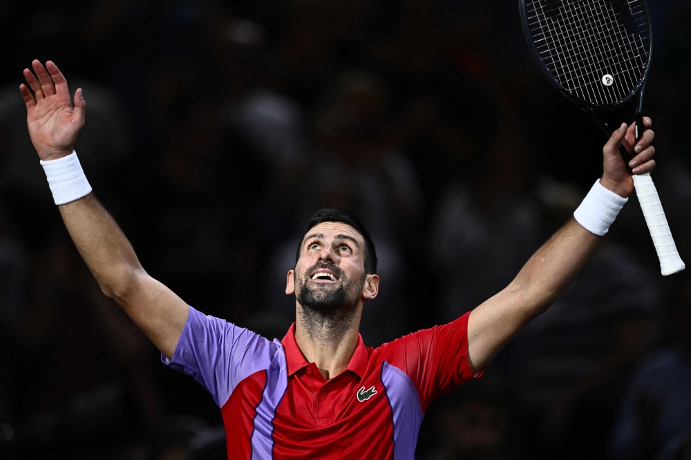 Serbia's Novak Djokovic celebrates after winning his men's singles match against Argentina's Tomas Martin Etcheverry on day three of the Paris ATP Masters 1000 tennis tournament at the Accor Arena - Palais Omnisports de Paris-Bercy - in Paris on November 1, 2023. — AFP pic