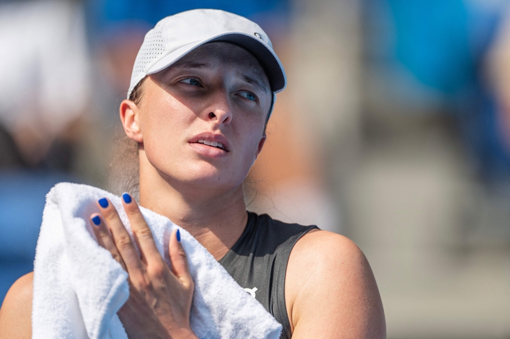 World number two Iga Swiatek defeated third-ranked Coco Gauff 6-0, 7-5 in a showdown of reigning Grand Slam champions. — AFP pic