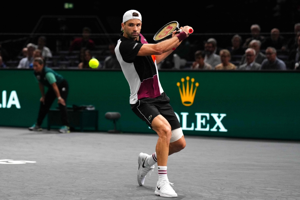 Bulgaria’s Grigor Dimitrov plays a backhand return to Kazakhstan’s Alexander Bublik during their men’s singles match on day four of the Paris ATP Masters 1000 tennis tournament at the Accor Arena, Palais Omnisports de Paris-Bercy, in Paris on November 2, 2023. — AFP pic 