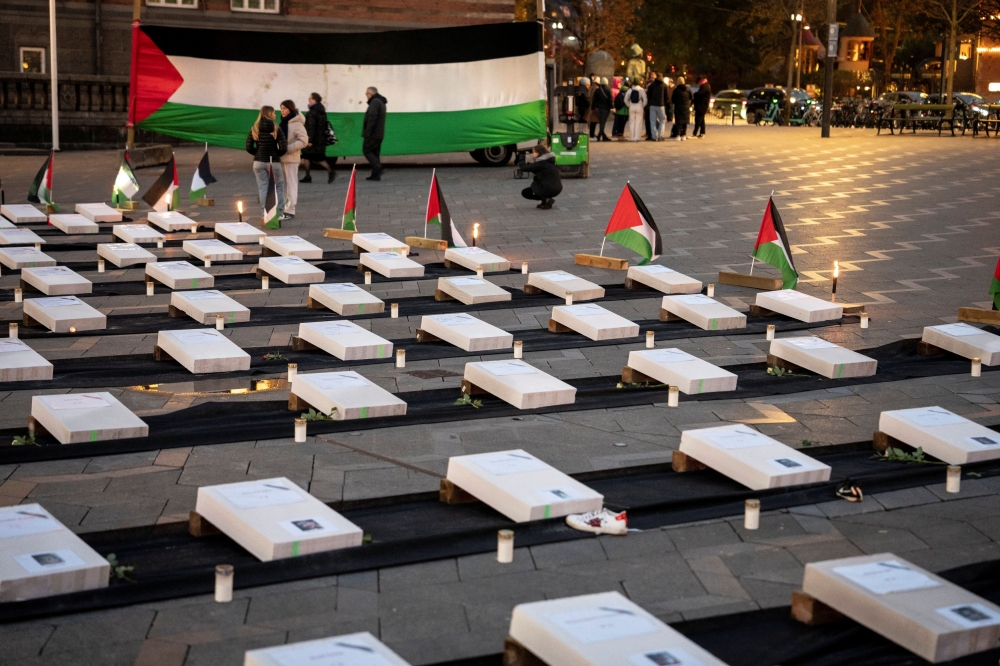 The memorial service ‘Children Pay The Price’ in support of the children in Gaza and Palestine, is held on City Hall Square in Copenhagen October, 27 2023. — Mads Claus Rasmussen/Ritzau Scanpix/Reuters pic