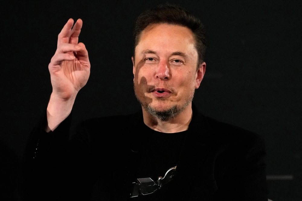 X (formerly Twitter) CEO Elon Musk gestures during an in-conversation event with Britain's Prime Minister Rishi Sunak in London on November 2, 2023, following the UK Artificial Intelligence (AI) Safety Summit. — — Kirsty Wigglesworth/Pool/AFP pic 