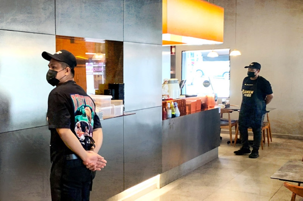 Attentive service staff stand at the ready at Ramen Mob.