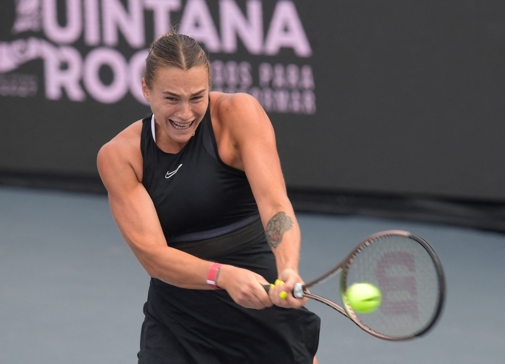 Belarus' Aryna Sabalenka returns the ball against Kazakhstan's Elena Rybakina during their women's singles match of the WTA Finals tennis championships in Cancun, Mexico November 3, 2023. — AFP pic