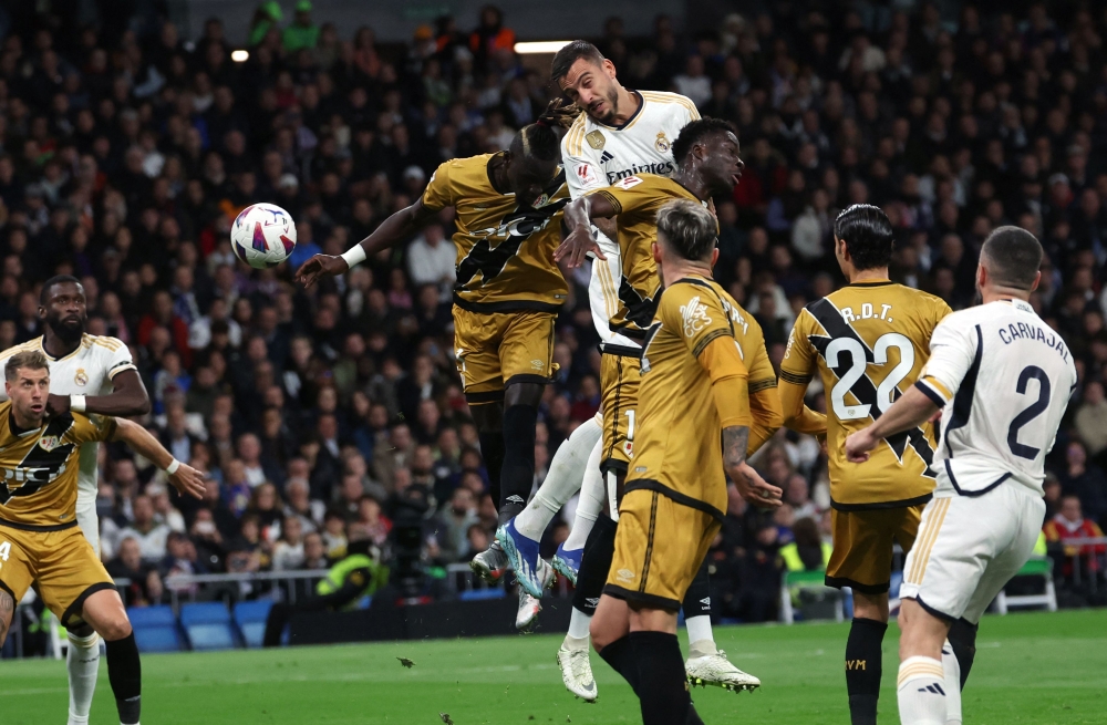 Real Madrid's Spanish forward Joselu heads the ball during the Spanish league football match between Real Madrid CF and Rayo Vallecano de Madrid at the Santiago Bernabeu stadium in Madrid November 5, 2023. — AFP pic