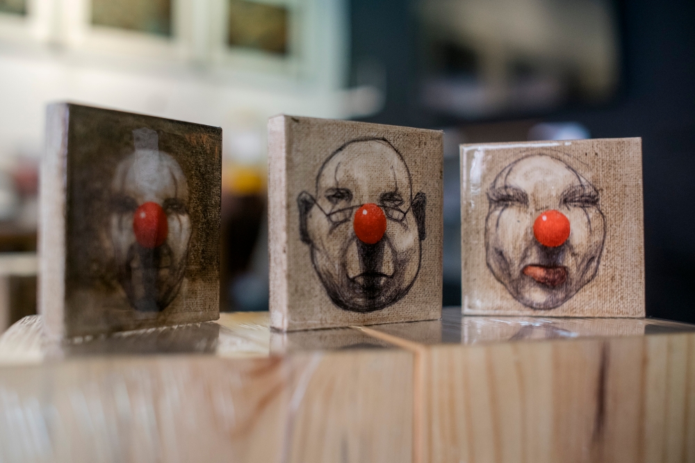 'Merchandise’ features a series of purpose-made wooden cubes with a portrait of a clown on a 3x3-inch canvas. — Picture by Shafwan Zaidon