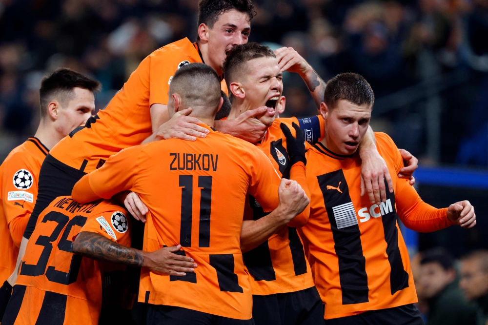 Shakhtar Donetsk's players celebrate the opening goal by Ukrainian forward #14 Danylo Sikan during the Uefa Champions League Group H football match between FC Shakhtar Donetsk and FC Barcelona in Hamburg, northern Germany on November 7, 2023. — AFP pic